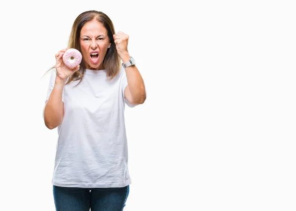 Mujer Hispana Mediana Edad Comiendo Rosquilla Sobre Fondo Aislado Molesto — Foto de Stock