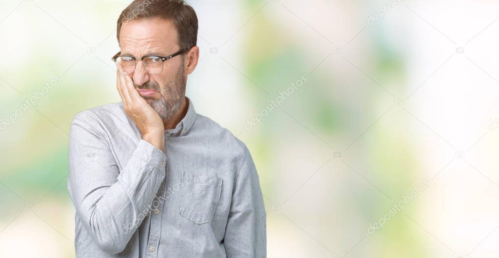 Handsome middle age elegant senior man wearing glasses over isolated background thinking looking tired and bored with depression problems with crossed arms.