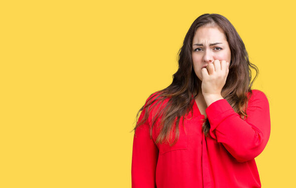 Beautiful plus size young business woman over isolated background looking stressed and nervous with hands on mouth biting nails. Anxiety problem.