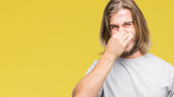 Young Handsome Man Long Hair Isolated Background Smelling Something Stinky — Stock Photo, Image