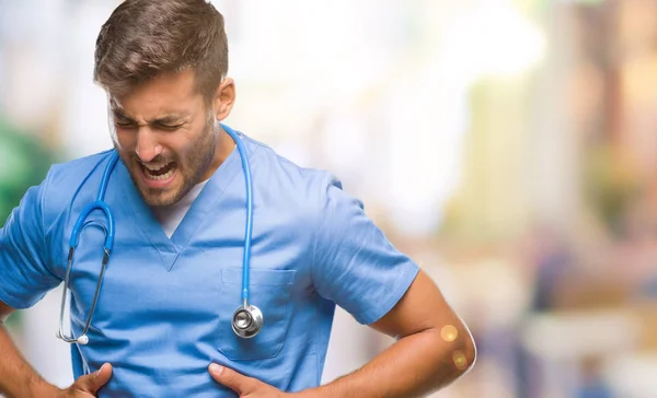 Joven Cirujano Médico Guapo Hombre Sobre Fondo Aislado Con Mano —  Fotos de Stock