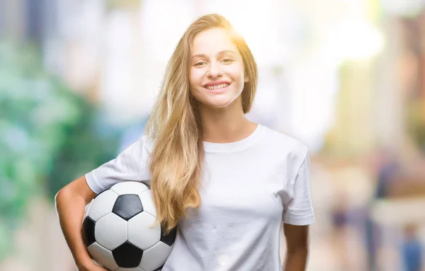 Joven Mujer Rubia Hermosa Sosteniendo Pelota Fútbol Sobre Fondo Aislado —  Fotos de Stock