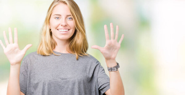 Beautiful young woman wearing oversize casual t-shirt over isolated background showing and pointing up with fingers number ten while smiling confident and happy.