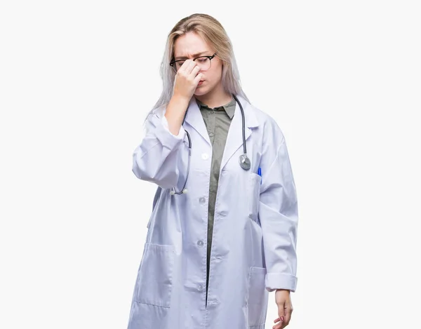 Young Blonde Doctor Woman Isolated Background Tired Rubbing Nose Eyes — Stock Photo, Image