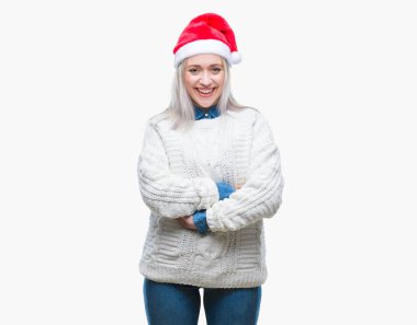 Sarışın genç kadın üzerinde Noel şapka ile mutlu yüz gülümseyerek kameraya seyir silah geçti arka plan izole. Olumlu bir kişi.