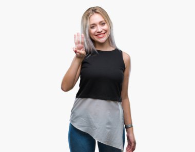 Sarışın genç kadın gösterilen ve parmakları ile işaret izole arka plan üzerinde üçüncü ise kendinden emin ve mutlu gülümseyerek.