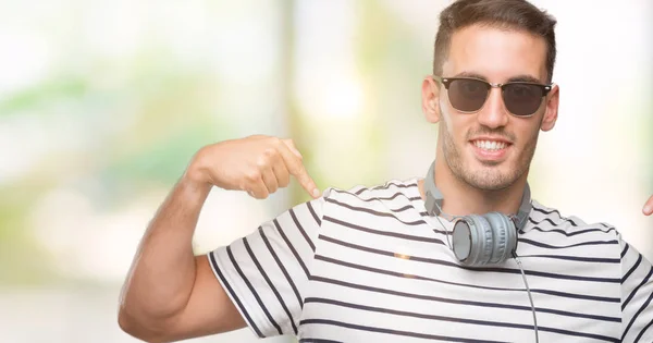 Handsome Young Man Wearing Headphones Looking Confident Smile Face Pointing — Stock Photo, Image