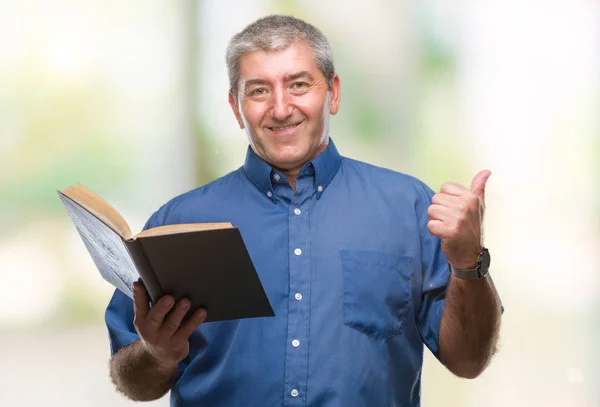 Handsome Senior Teacher Man Reading Book Isolated Background Pointing Showing — Stock Photo, Image