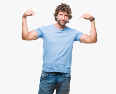 Handsome hispanic model man over isolated background looking confident with smile on face, pointing oneself with fingers proud and happy. clipart