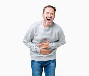 Bir kazak izole üzerinde giyen yakışıklı orta yaş üst düzey adam arka plan gülen ve komik deli şaka çünkü yüksek sesle zor gülüyor. Mutlu ifade.