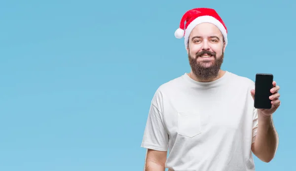 Junger Kaukasischer Mann Mit Weihnachtsmütze Smartphone Bildschirm Vor Isoliertem Hintergrund — Stockfoto