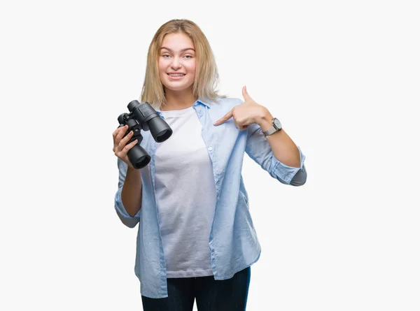 Young Caucasian Woman Holding Binoculars Isolated Background Surprise Face Pointing — Stock Photo, Image