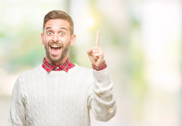 Joven Hombre Guapo Con Suéter Invierno Sobre Fondo Aislado Señalando — Foto de Stock