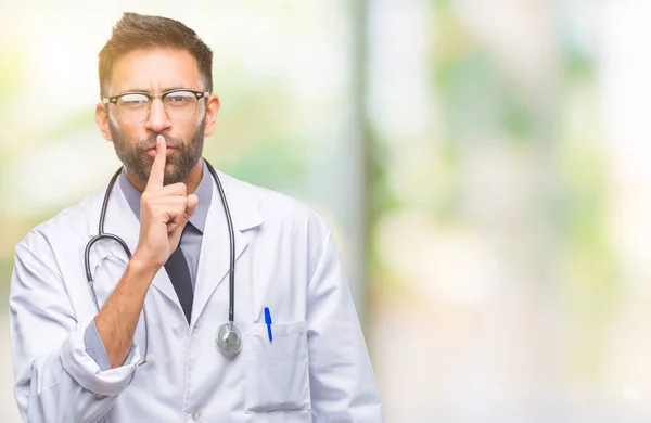 Adult Hispanic Doctor Man Isolated Background Asking Quiet Finger Lips — Stock Photo, Image