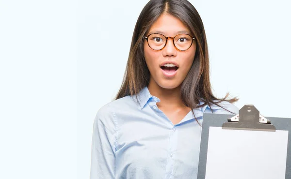 Young Asian Business Woman Isolated Background Holding Clipboard Scared Shock — Stock Photo, Image