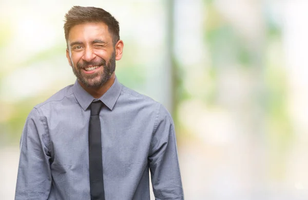 Volwassen Spaanse Zakenman Geïsoleerde Achtergrond Winking Kijken Naar Camera Met — Stockfoto