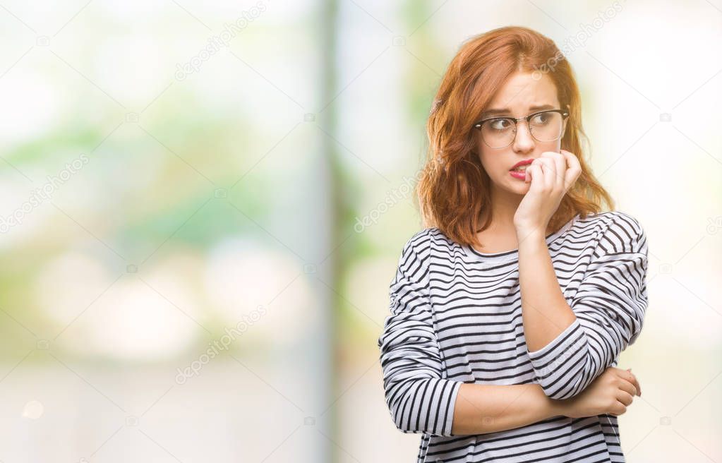 Young beautiful woman over isolated background wearing glasses looking stressed and nervous with hands on mouth biting nails. Anxiety problem.