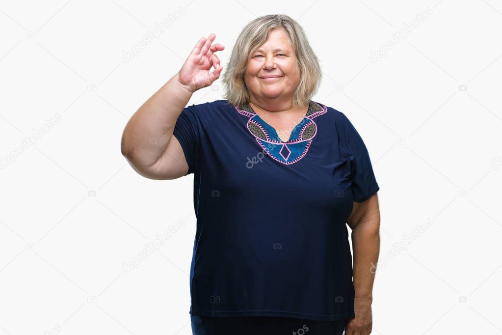 Senior plus size caucasian woman over isolated background smiling positive doing ok sign with hand and fingers. Successful expression.