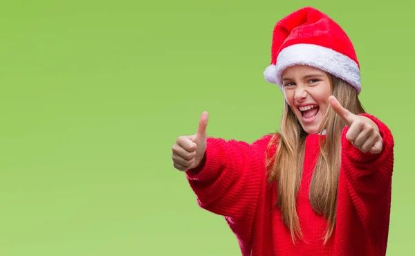 손으로 긍정적인 제스처를 크리스마스 모자를 소녀는 미소를 성공을 카메라 우승자 — 스톡 사진