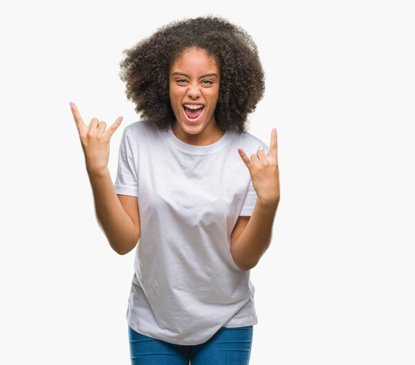 Young afro american woman over isolated background shouting with crazy expression doing rock symbol with hands up. Music star. Heavy concept.