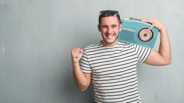 Young Caucasian Man Grey Grunge Wall Listening Music Vintage Radio — Stock Photo, Image