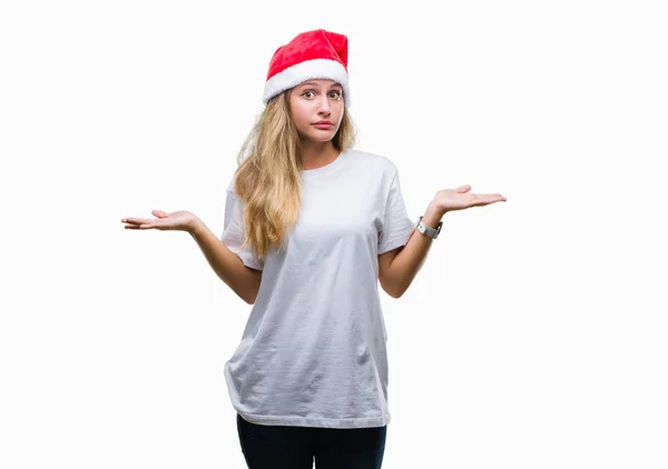 Молодая Красивая Блондинка Рождественской Шляпе Изолированном Фоне Невежественное Запутанное Выражение — стоковое фото
