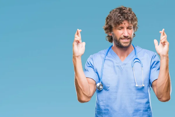 Handsome Hispanic Surgeon Doctor Man Isolated Background Smiling Crossing Fingers — Stock Photo, Image