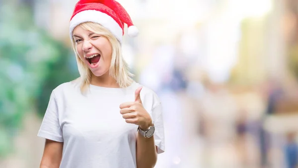 Jonge Mooie Blonde Vrouw Kerstmuts Dragen Geïsoleerde Achtergrond Gelukkig Duimschroef — Stockfoto