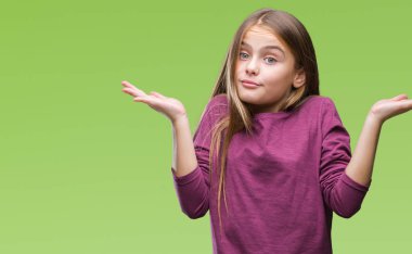 Genç güzel kız yüzünden izole arka plan clueless ve şaşkın bir ifadeyle kollar ve eller kaldırdı. Şüphe kavramı.