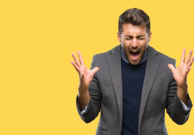 Genç iş adamı üzerinde arka plan deli kutluyor izole ve crazy arms ile başarı için kaldırdı ve heyecanlı çığlık gözleri kapalı yakışıklı. Kazanan kavramı