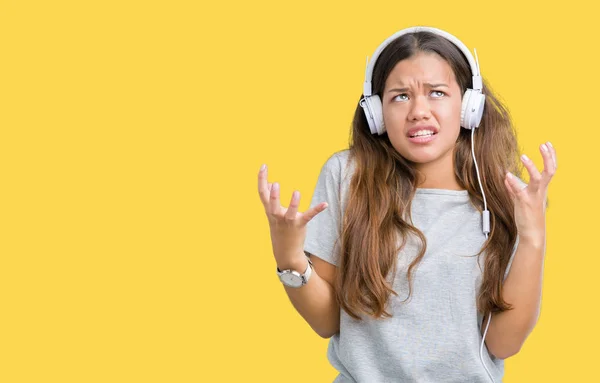 Fiatal Gyönyörű Fárasztó Fejhallgató Zenét Hallgatni Mint Elszigetelt Háttér Őrült — Stock Fotó