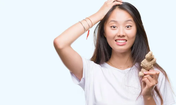 Mujer Asiática Joven Sosteniendo Fresco Orgánico Sobre Fondo Aislado Estresado —  Fotos de Stock