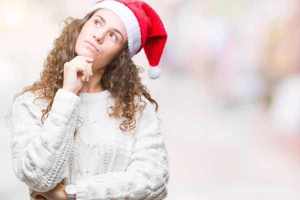 Young Brunette Girl Wearing Christmas Hat Isolated Background Hand Chin — Stock Photo, Image