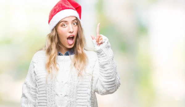 美丽的年轻金发碧眼的女人戴着圣诞帽在孤立的背景指向手指与成功的想法 离开和快乐 — 图库照片