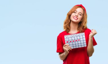 Duygu tezahürat izole arka plan gurur çığlık ve zafer ve başarı çok heyecanlı, kutluyor adet takvim tutan genç güzel kadın