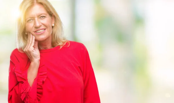 Middle age blonde woman over isolated background touching mouth with hand with painful expression because of toothache or dental illness on teeth. Dentist concept.