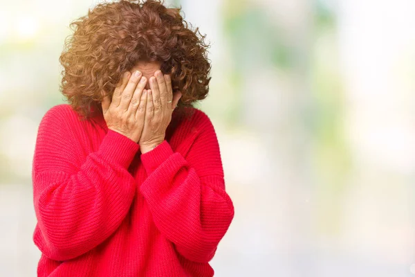美丽的中年女性红色冬季毛衣在孤立的背景与悲伤的表情覆盖着脸与手 而哭泣 抑郁症的概念 — 图库照片