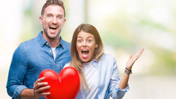 Young Couple Love Holding Red Heart Isolated Background Very Happy — Stock Photo, Image