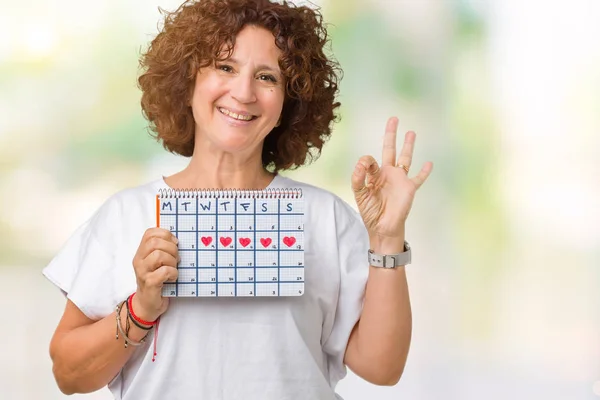 Médio Ager Mulher Sênior Segurando Calendário Menstruação Sobre Fundo Isolado — Fotografia de Stock
