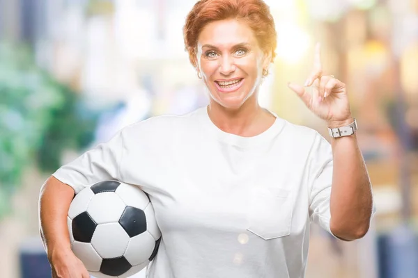 Atrractive Senior Caucasian Redhead Woman Holding Soccer Ball Isolated Background — Stock Photo, Image