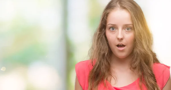 Young Blonde Woman Wearing Pink Dress Scared Shock Surprise Face — Stock Photo, Image