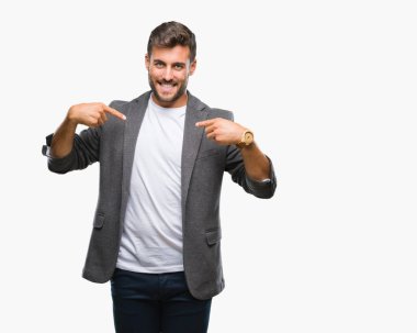 Genç yakışıklı iş adamı yüzünde gülümseme ile kendinden emin görünüyorsun, kendini gururlu ve mutlu parmakları ile işaret izole arka plan üzerinde.