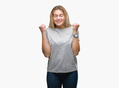 Zafer kutluyor gülümseyen izole arka kolları olan başarı için heyecanlı Genç beyaz kadın kaldırdı. Kazanan kavramı.