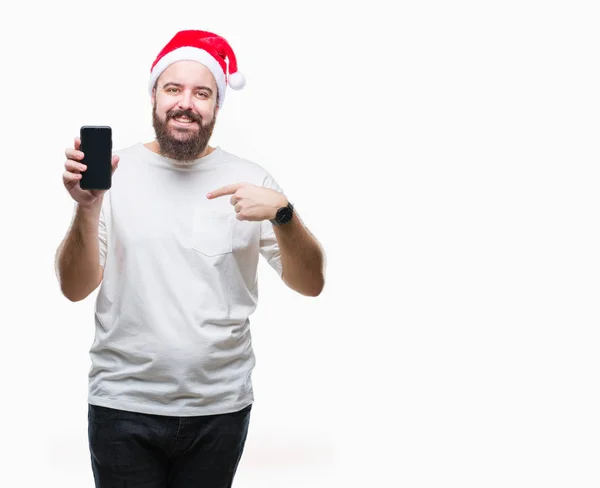 Junger Kaukasischer Mann Mit Weihnachtsmütze Zeigt Smartphone Bildschirm Vor Isoliertem — Stockfoto