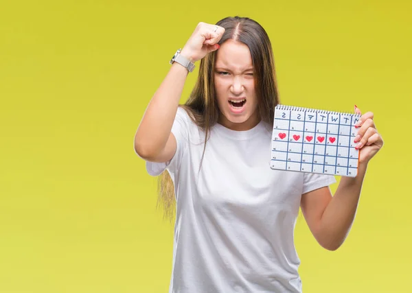 Jonge Kaukasische Vrouw Holding Menstruatie Kalender Geïsoleerde Achtergrond Boos Gefrustreerd — Stockfoto