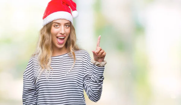 Linda Jovem Loira Vestindo Chapéu Natal Sobre Fundo Isolado Apontando — Fotografia de Stock