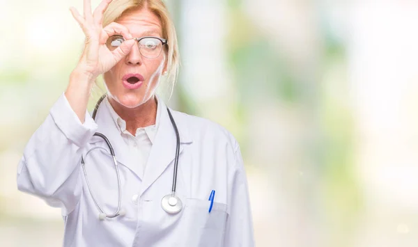 Middle Age Blonde Doctor Woman Isolated Background Doing Gesture Shocked — Stock Photo, Image