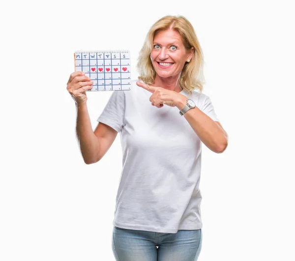 Medelålders Blond Kvinna Håller Menstruation Kalender Ver Isolerade Bakgrund Mycket — Stockfoto