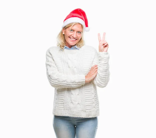 Blonde Frau Mittleren Alters Mit Weihnachtsmütze Vor Isoliertem Hintergrund Lächelnd — Stockfoto