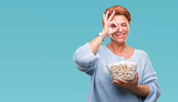 Atrractive Senior Caucasian Redhead Woman Eating Popcorn Isolated Background Happy — Stock Photo, Image